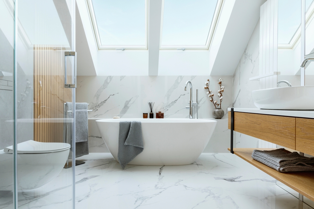 Stylish,Bathroom,Interior,Design,With,Marble,Panels.,Bathtub,,Towels