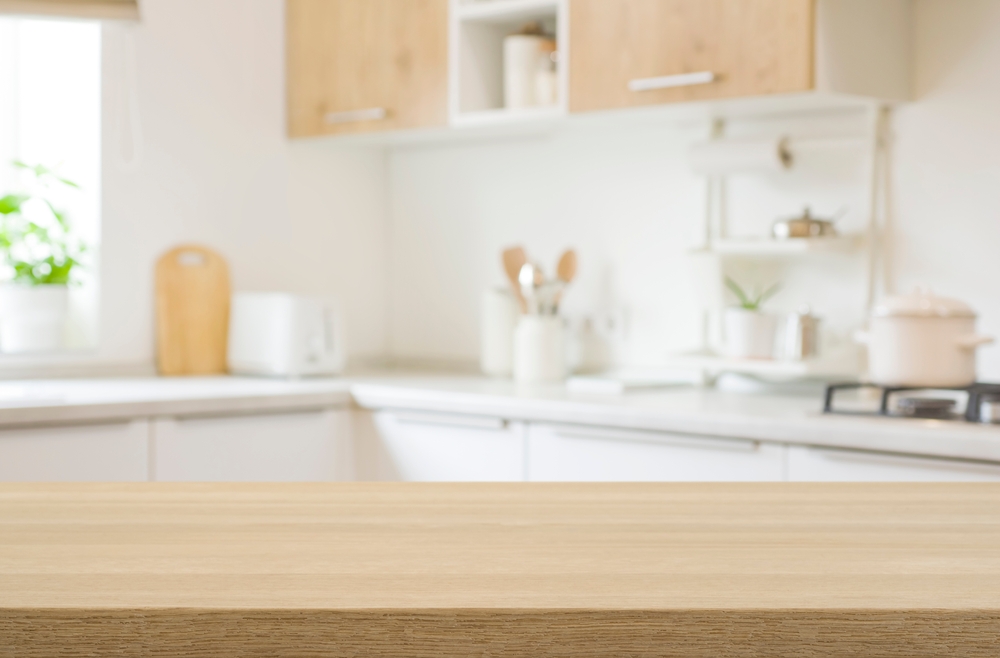 Kitchen,Table,Top,For,Product,Display,With,Blurred,Modern,Interior